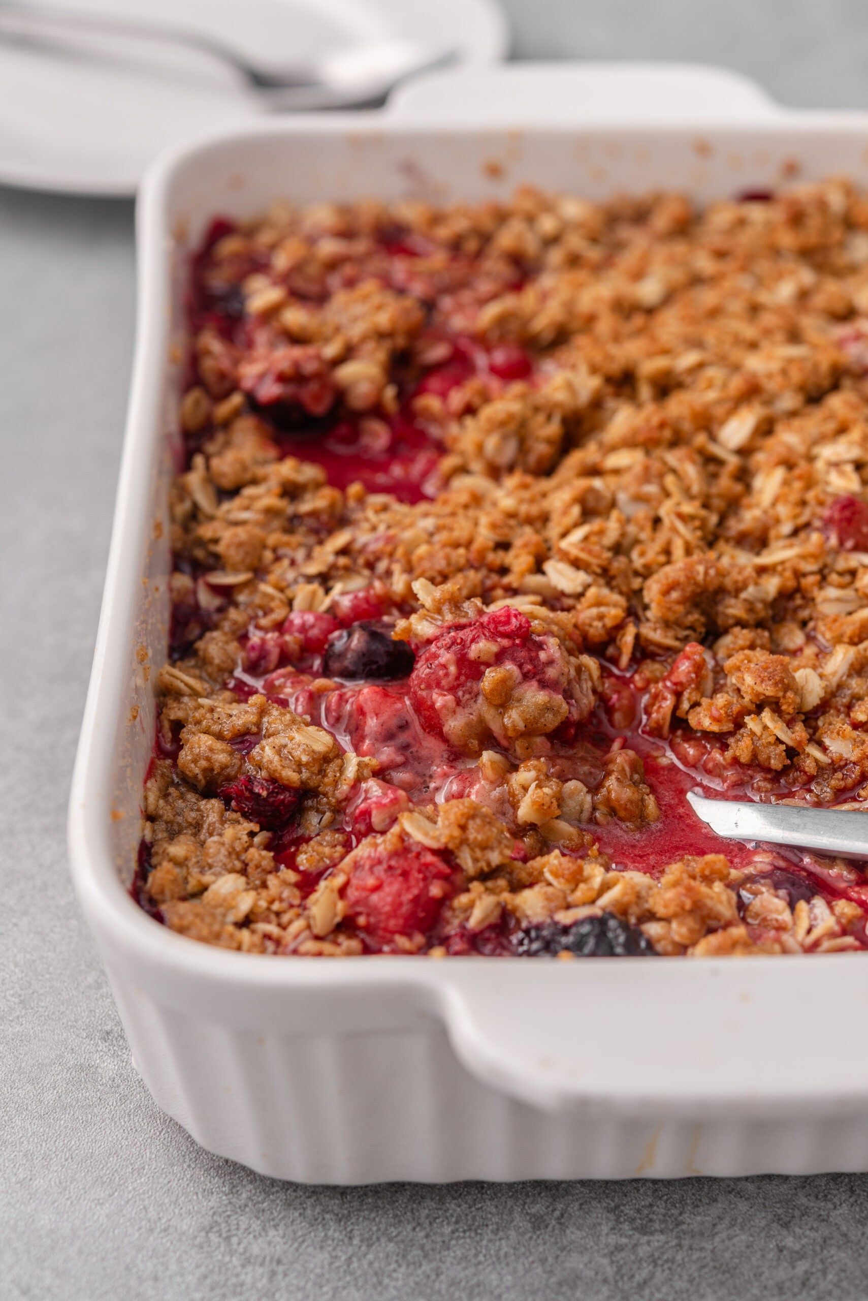 Berry crisp recipe in a plate shot from diagonal