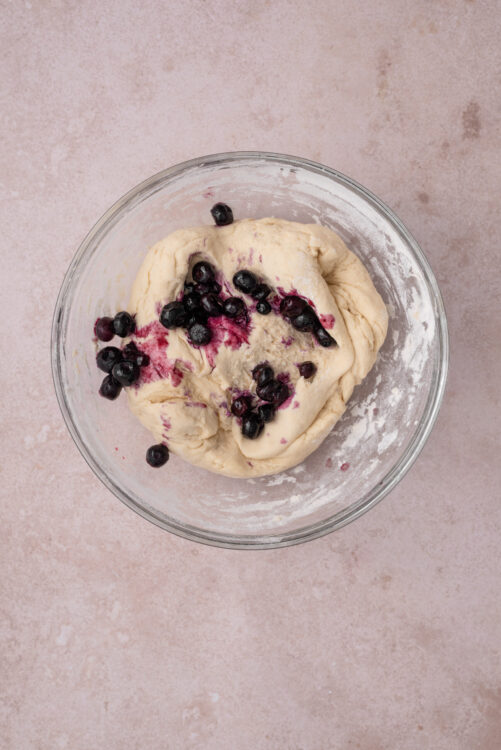 Blueberry bagel dough with blueberries gently folded in.