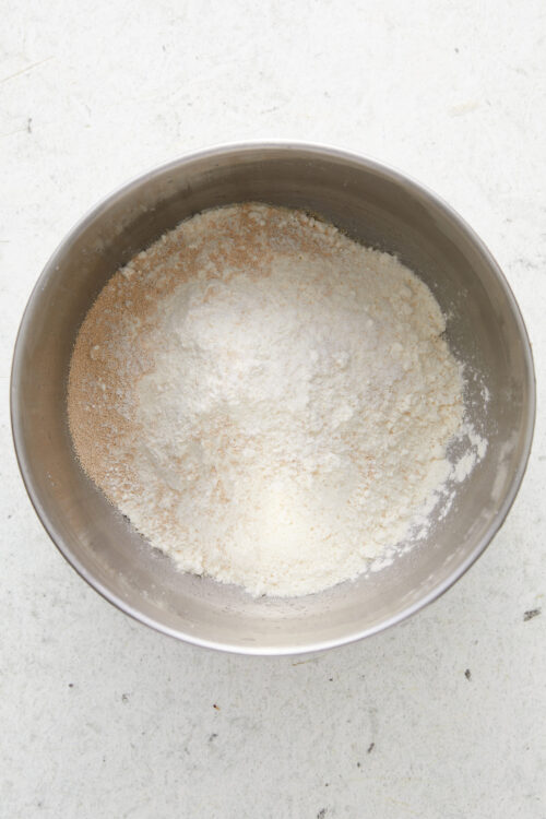 Whisking together bread flour, instant yeast, sugar, and salt for Cheese Bread.