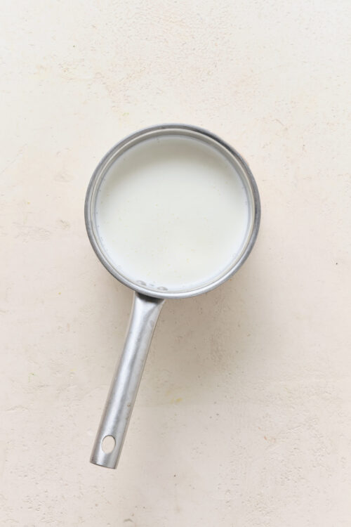 Half-and-half simmering in a saucepan for Pot De Cr&egrave;me.