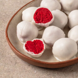Red Velvet Cake Balls on a plate diagonal shot