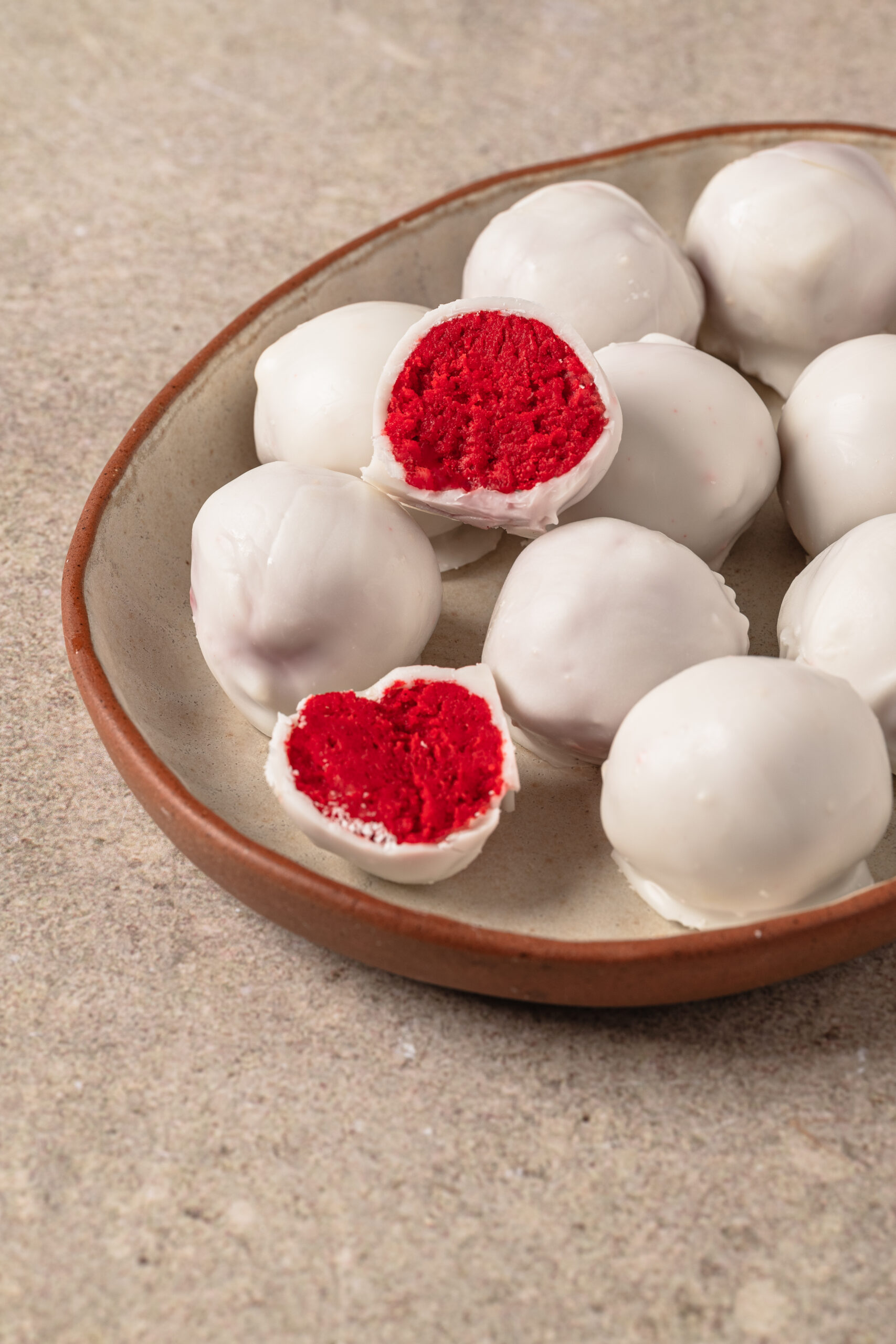 Red Velvet Cake Balls on a plate shot from diagonal