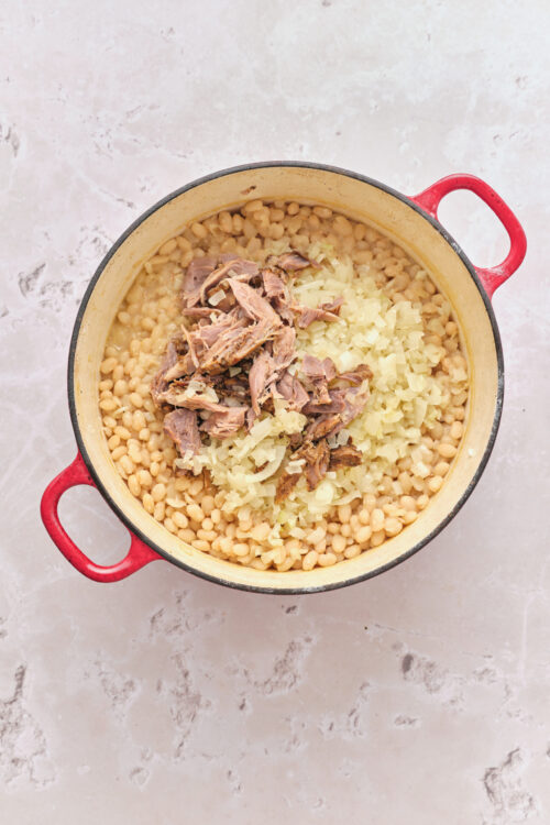 Returning shredded ham hock and saut&eacute;ed onions to Senate Bean Soup.