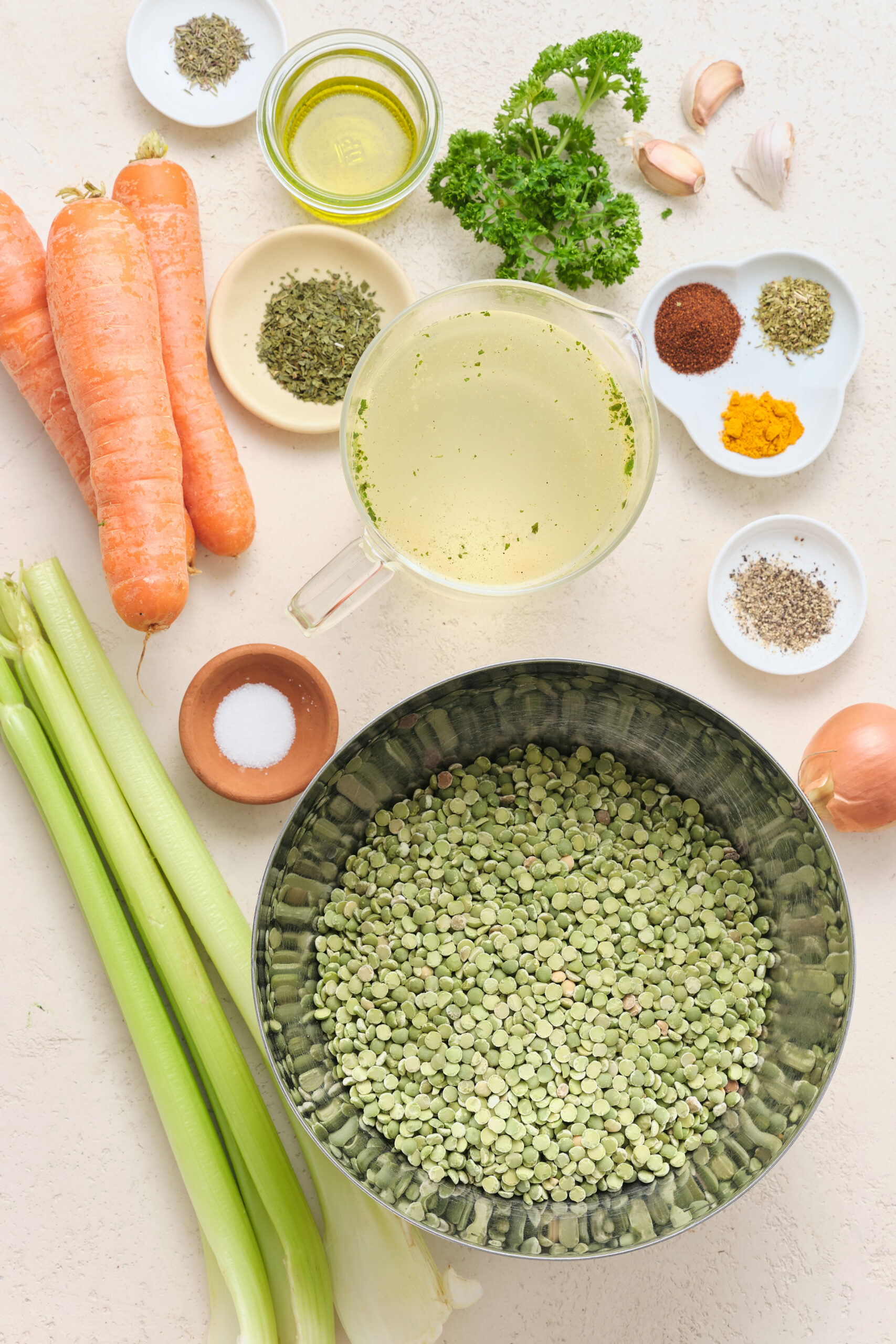 Ingredients for Vegan Split Pea Soup: dried split peas, carrots, celery, onion, garlic, vegetable broth, and spices.
