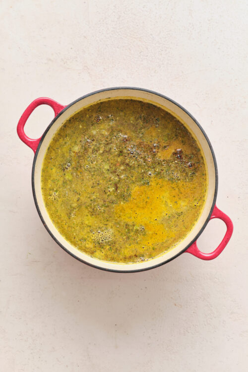 Vegan Split Pea Soup simmering in a red pot.